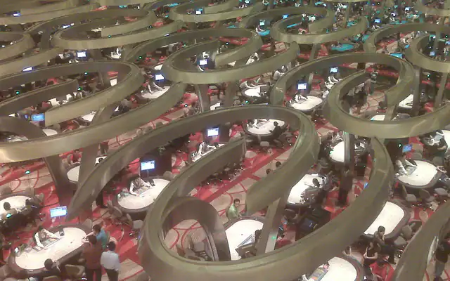 Players at live baccarat tables