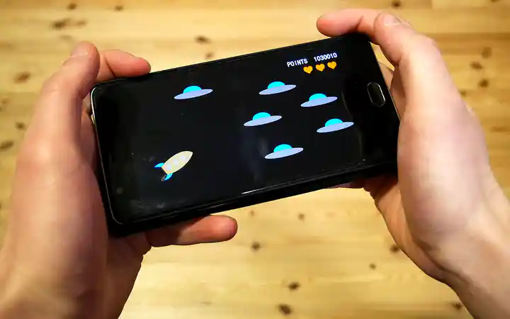 Player holding a smartphone